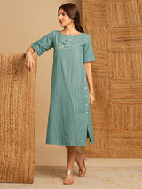 Embroidered A line dress in cotton stripe fabric with button detailing.