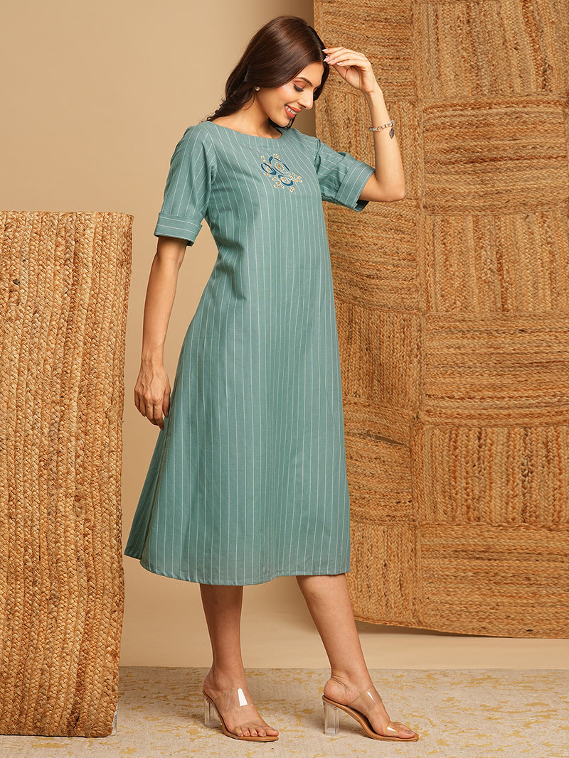 Embroidered A line dress in cotton stripe fabric with button detailing.