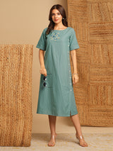 Embroidered A line dress in cotton stripe fabric with button detailing.