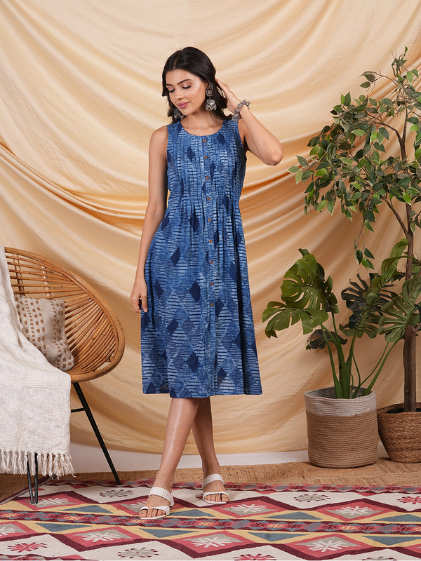 A-Line Pleated sleeveless dress in cotton dhabu print.