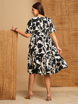 Printed cotton flared dress with gathering and pocket.