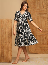 Printed cotton flared dress with gathering and pocket.