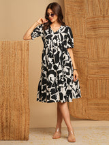 Printed cotton flared dress with gathering and pocket.