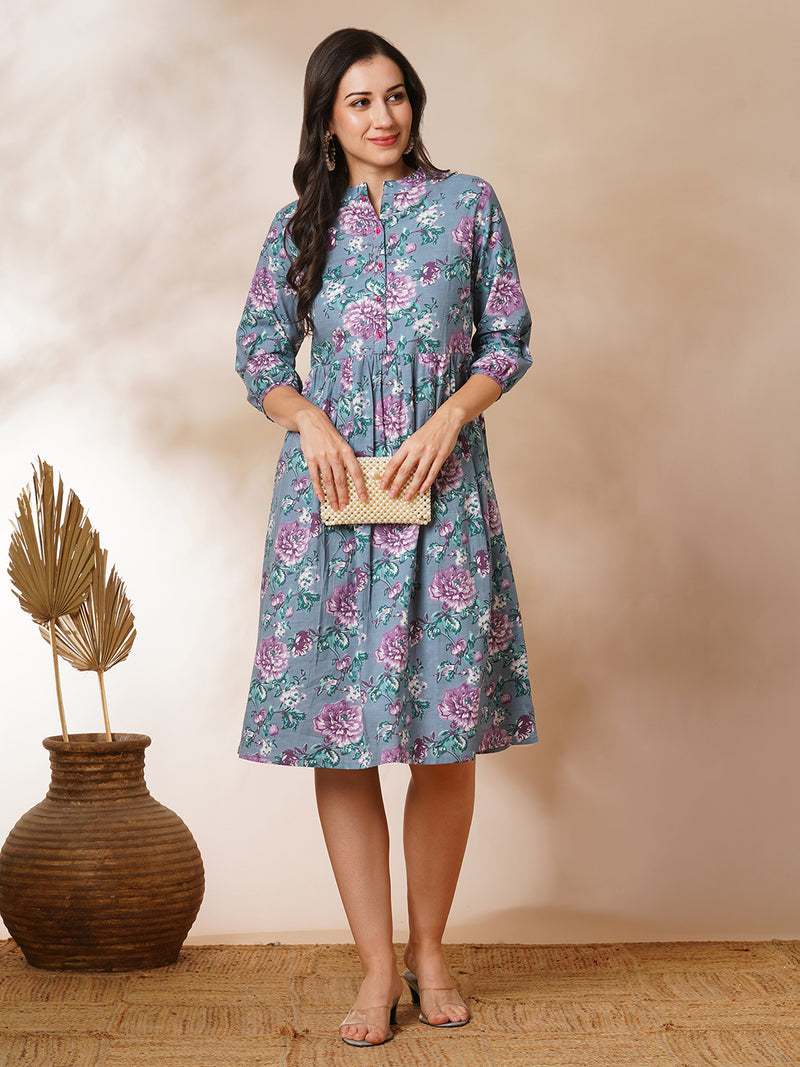 Fit and flared floral printed gathered dress with stand collar, placket and sleeve detailing.