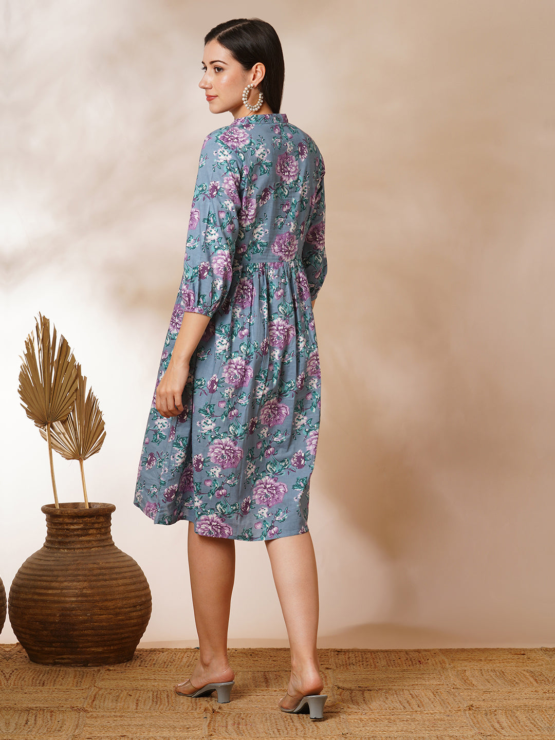 Fit and flared floral printed gathered dress with stand collar, placket and sleeve detailing