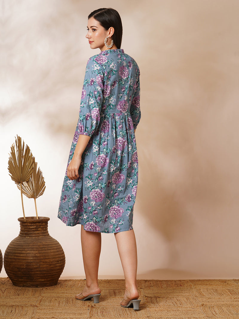 Fit and flared floral printed gathered dress with stand collar, placket and sleeve detailing.