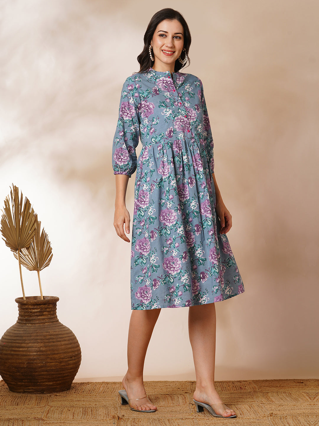 Fit and flared floral printed gathered dress with stand collar, placket and sleeve detailing