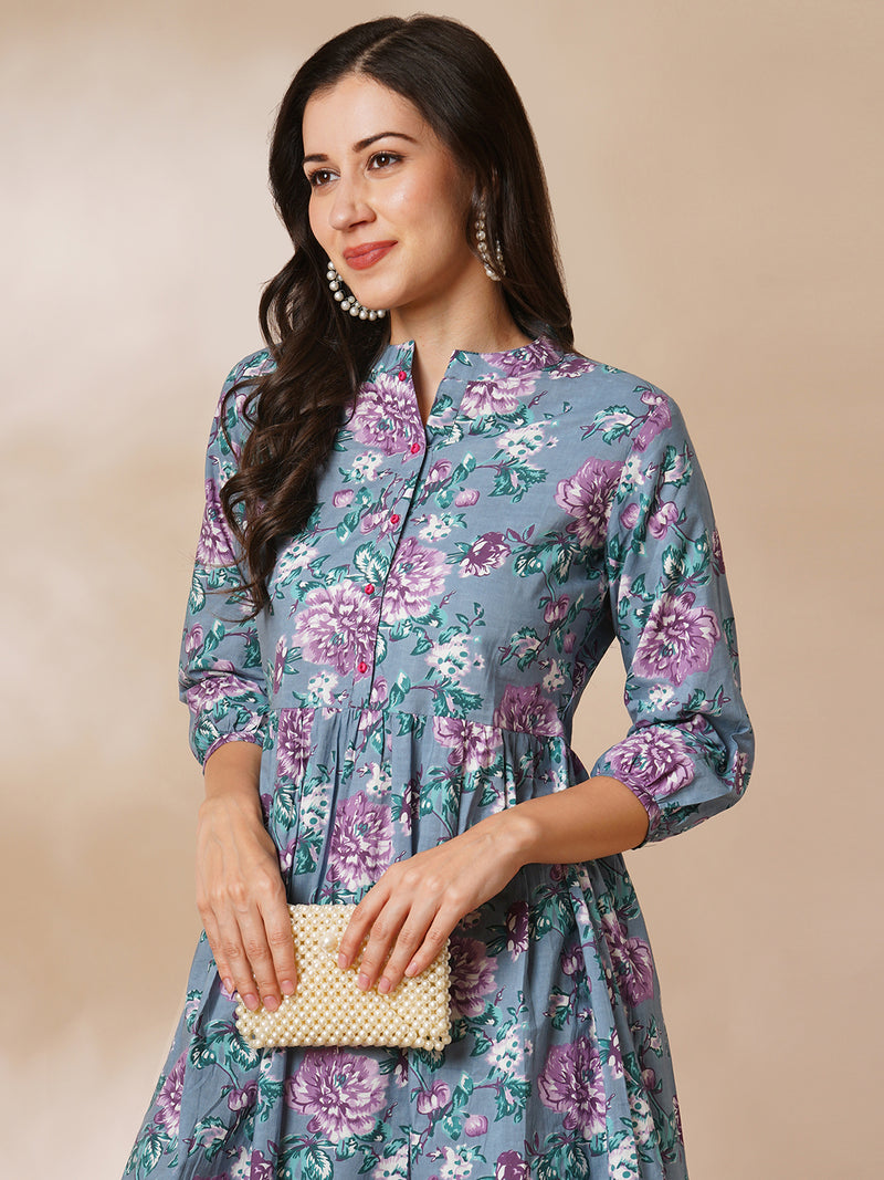 Fit and flared floral printed gathered dress with stand collar, placket and sleeve detailing.