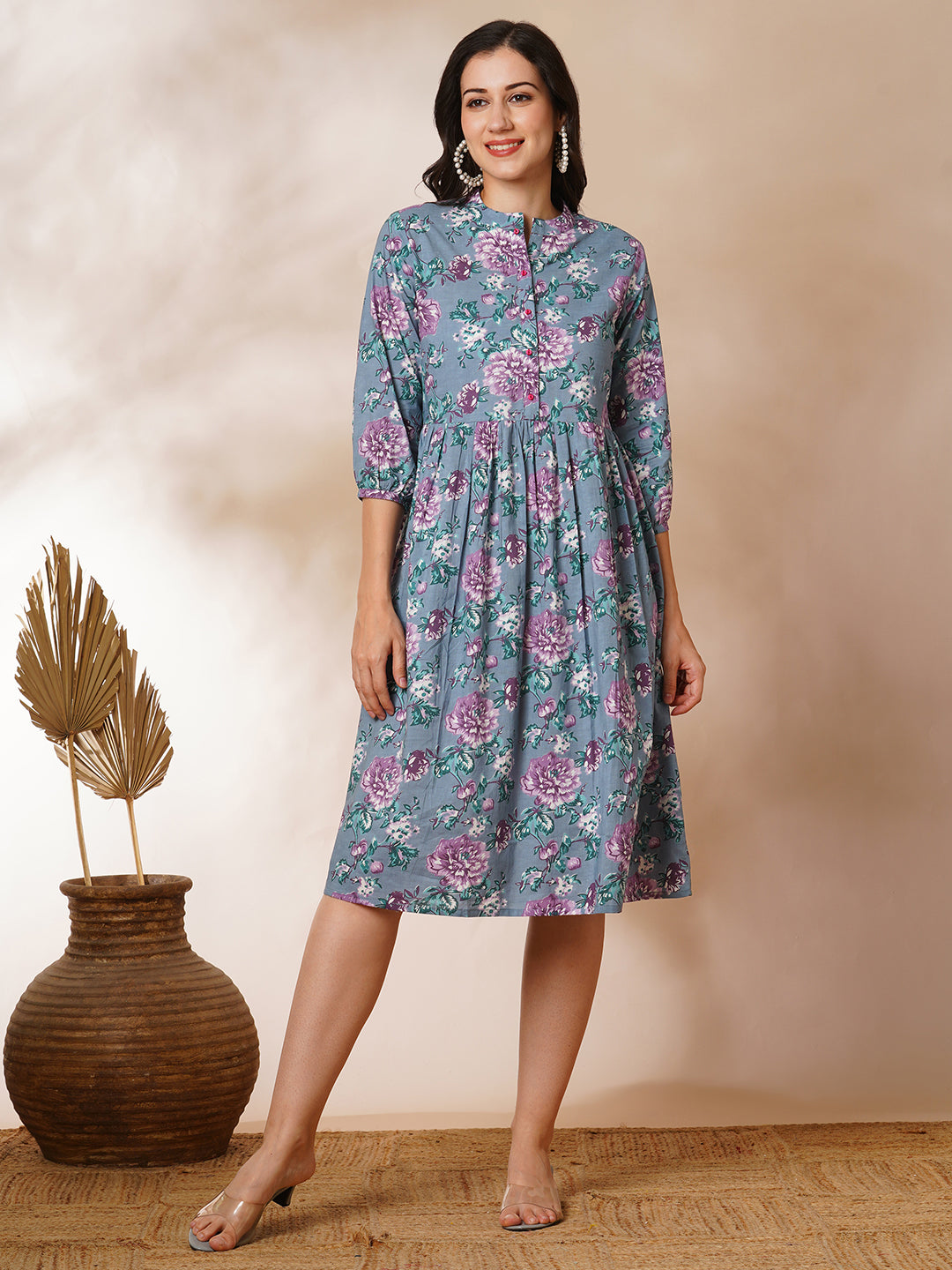 Fit and flared floral printed gathered dress with stand collar, placket and sleeve detailing