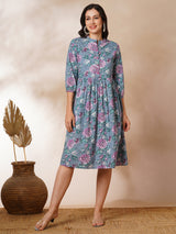 Fit and flared floral printed gathered dress with stand collar, placket and sleeve detailing.