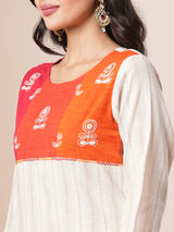 Straight kurta suit set features a handloom yoke embellished with dori work.