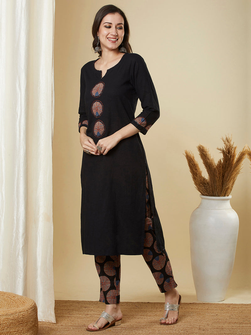 The black traditional geometric printed suit set with applique and hand detailing.