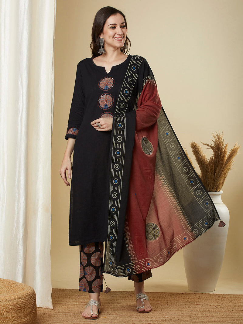 The black traditional geometric printed suit set with applique and hand detailing.