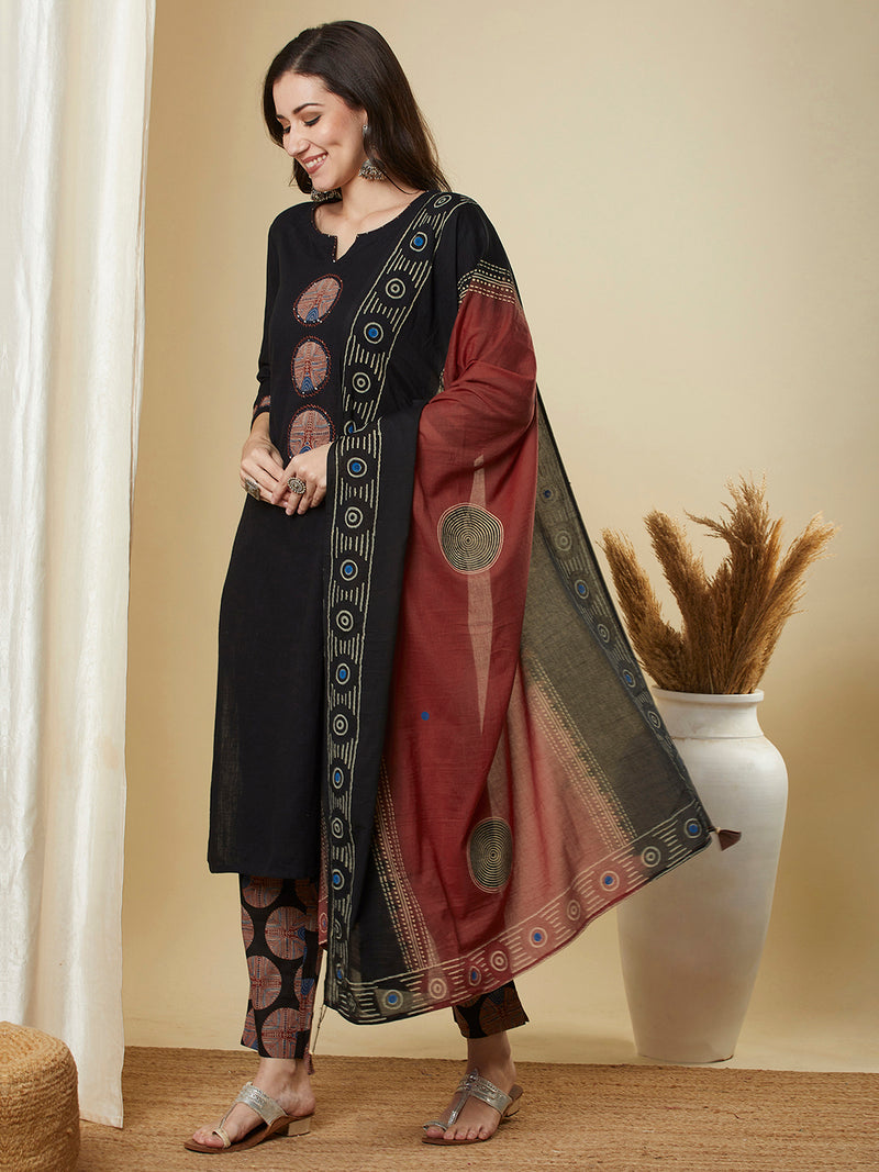 The black traditional geometric printed suit set with applique and hand detailing.