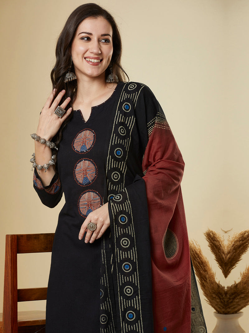 The black traditional geometric printed suit set with applique and hand detailing.