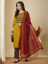 Mustard kurta suit set is paired with a printed bottom and a contrast color block-printed dupatta.