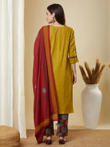 Mustard kurta suit set is paired with a printed bottom and a contrast color block-printed dupatta.