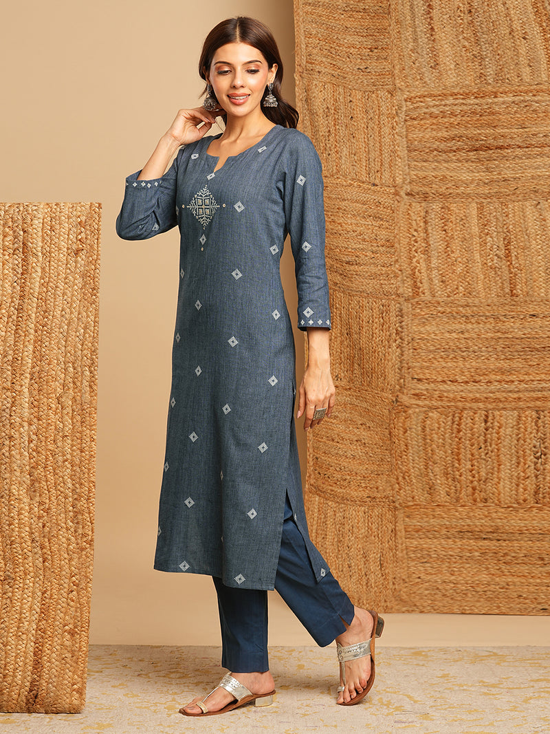 Straight kurta with minimal block print and hand work and traditional block printed dupatta.