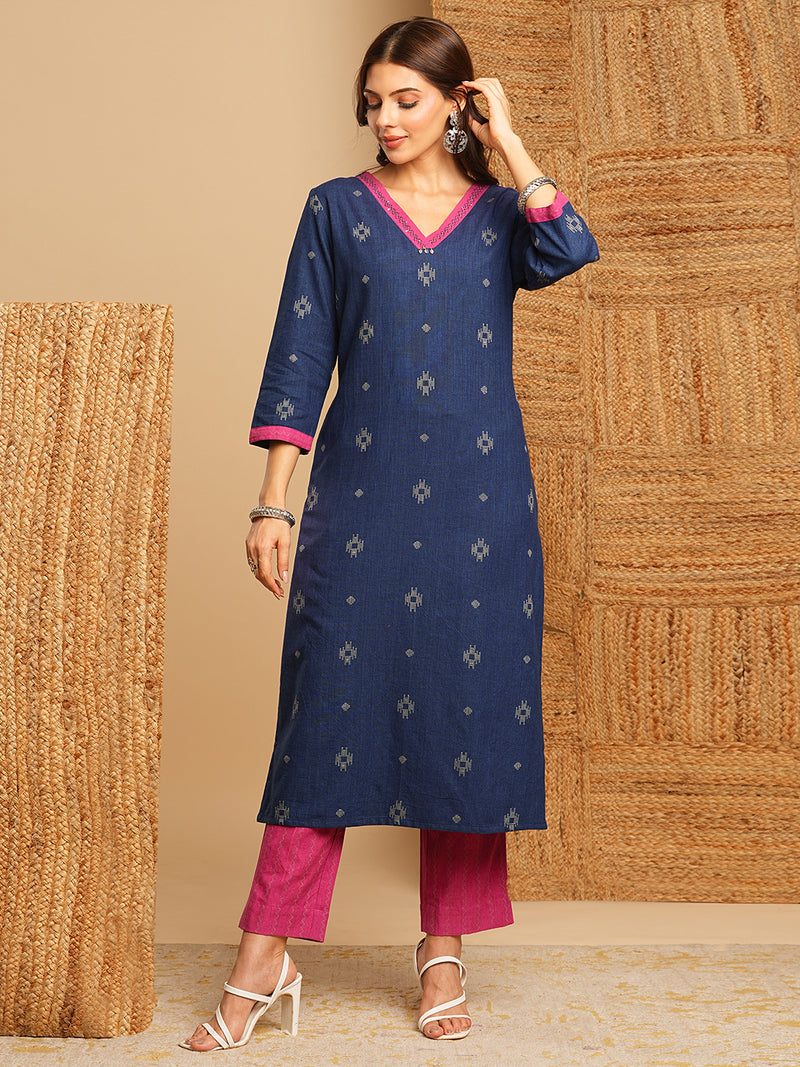 V-neck straight kurta with hand embroidery highlighted on the neckline Paired with double dye block printed  mull dupatta and straight pants.