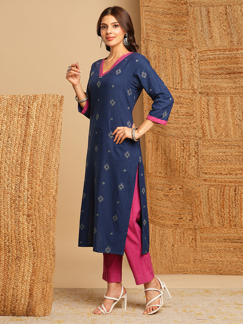 V-neck straight kurta with hand embroidery highlighted on the neckline Paired with double dye block printed  mull dupatta and straight pants.