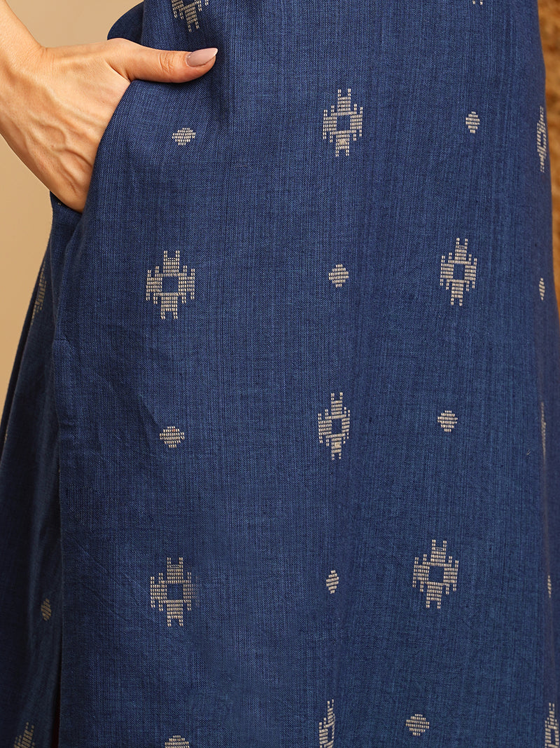 V-neck straight kurta with hand embroidery highlighted on the neckline Paired with double dye block printed  mull dupatta and straight pants.