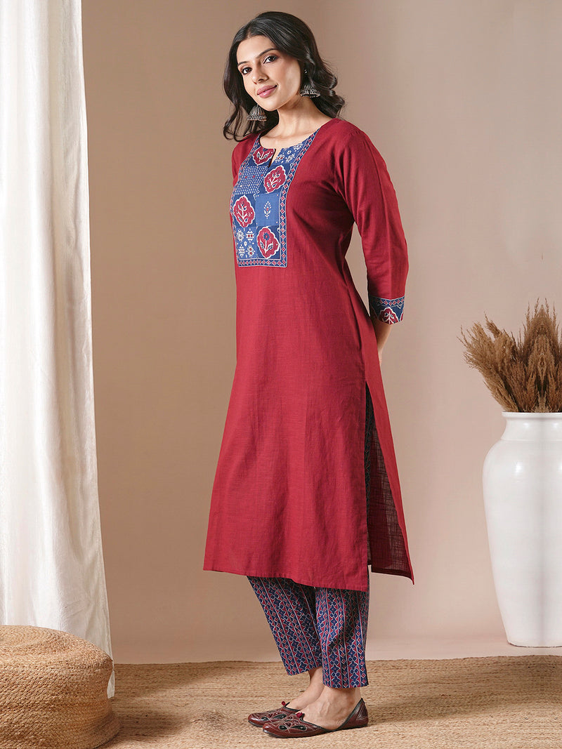 Maroon straight kurta set with traditional block printed bottoms and kota dupatta.