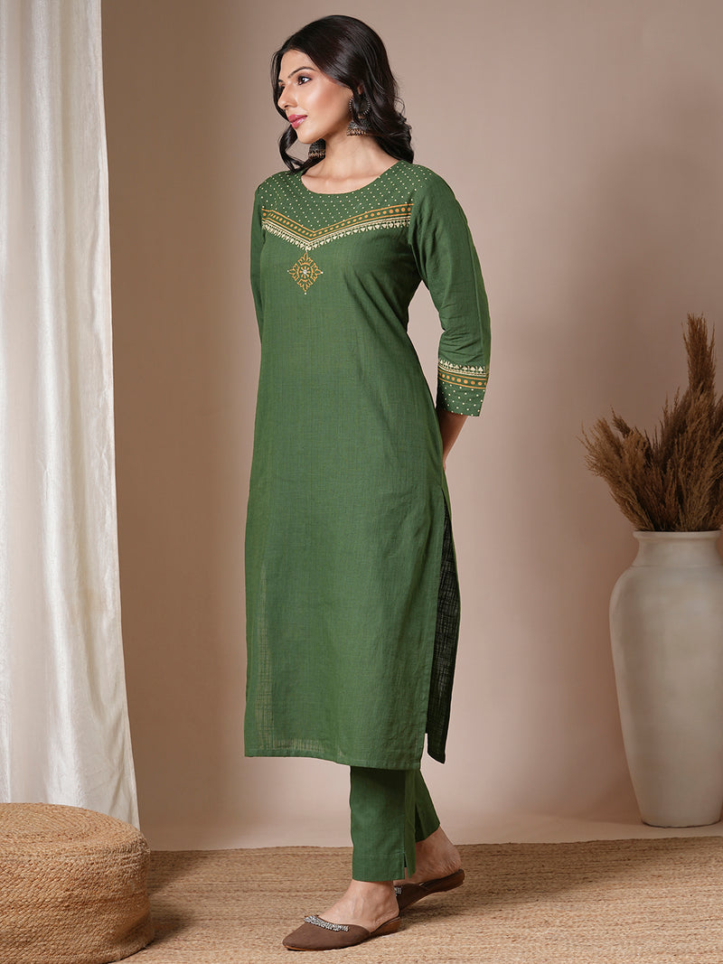 Green straight kurta set with geometrically printed mustard kota dupatta.