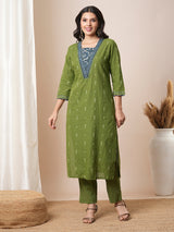 V-neck green dobby butti straight kurta suit set with floral dabu print yoke highlighted with handwork.