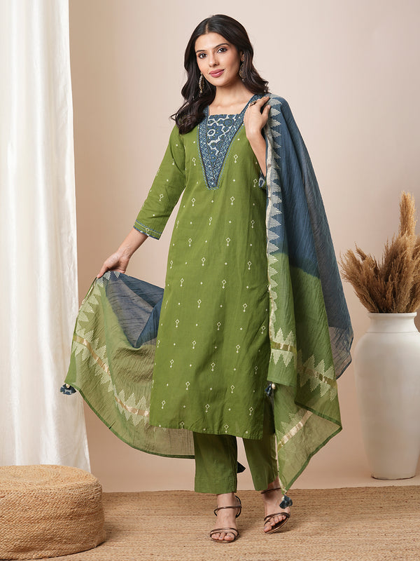 V-neck green dobby butti straight kurta suit set with floral dabu print yoke highlighted with handwork.