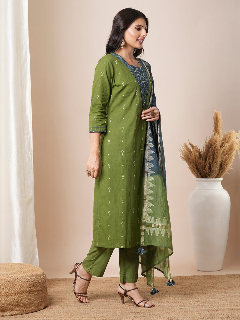 V-neck green dobby butti straight kurta suit set with floral dabu print yoke highlighted with handwork.