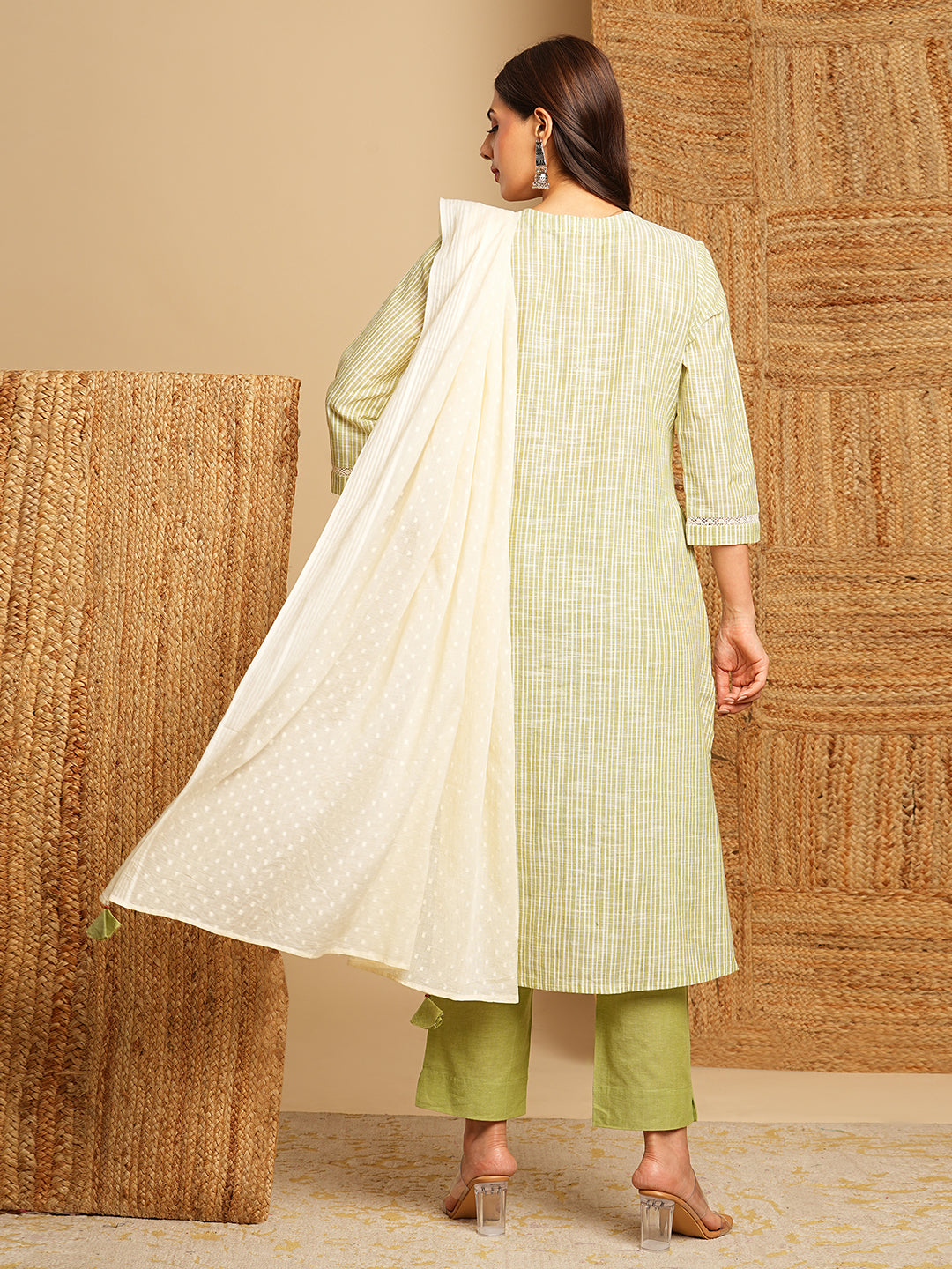 Light green straight kurta with delicate lace detailing  and embroidery on the yoke paired With a beige mull dupatta and self bottom