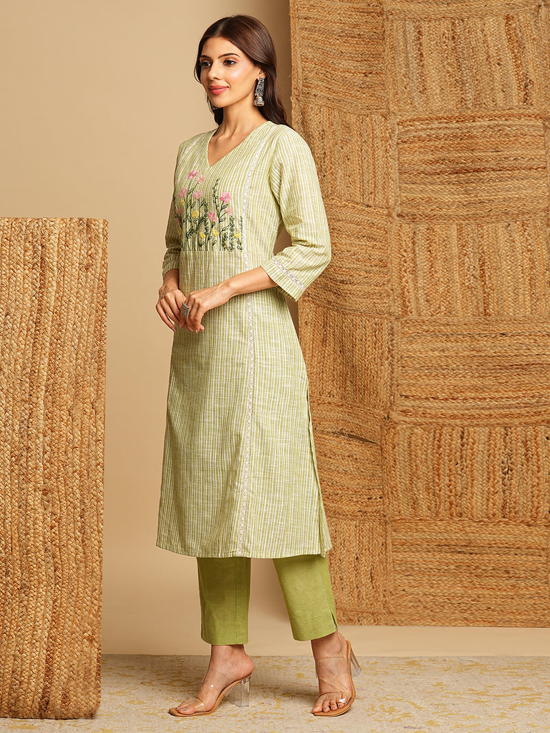 Light green straight kurta with delicate lace detailing  and embroidery on the yoke paired With a beige mull dupatta and self bottom.