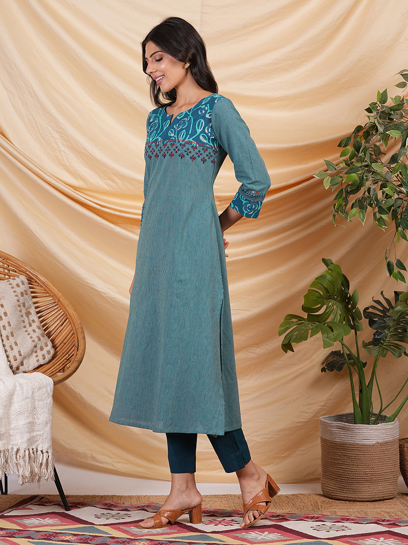 A line striped kurta with printed cotton trim,block print and hand embroidery.