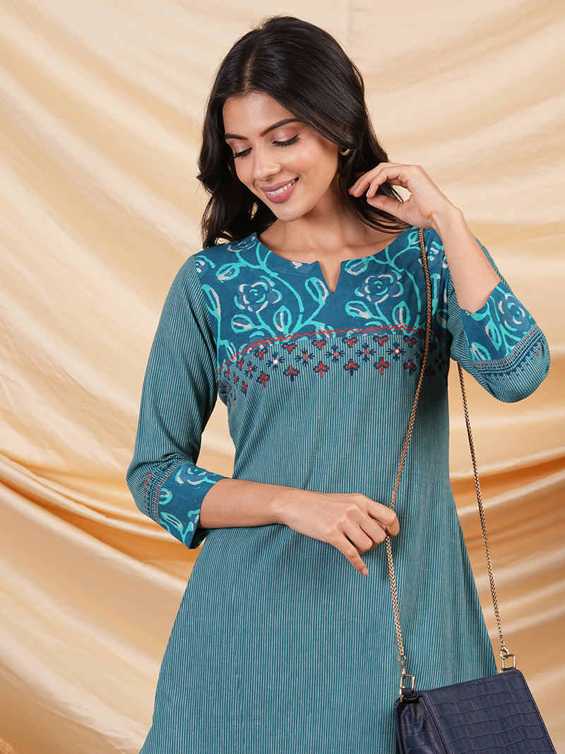 A line striped kurta with printed cotton trim,block print and hand embroidery.