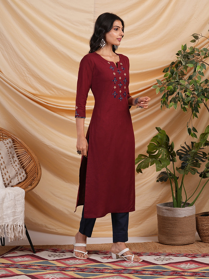 Straight Cotton flax kurta with hand embroidery and hand applique detailing.