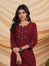 Straight Cotton flax kurta with hand embroidery and hand applique detailing.