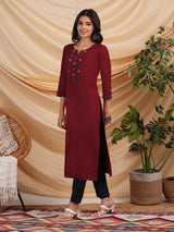 Straight Cotton flax kurta with hand embroidery and hand applique detailing.