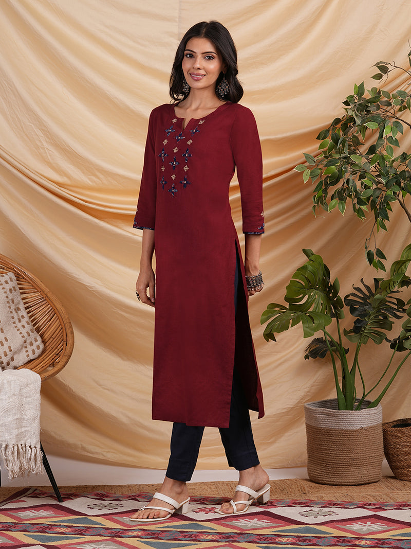 Straight Cotton flax kurta with hand embroidery and hand applique detailing.