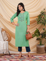 Straight Cotton flax kurta with hand embroidery and hand applique detailing.