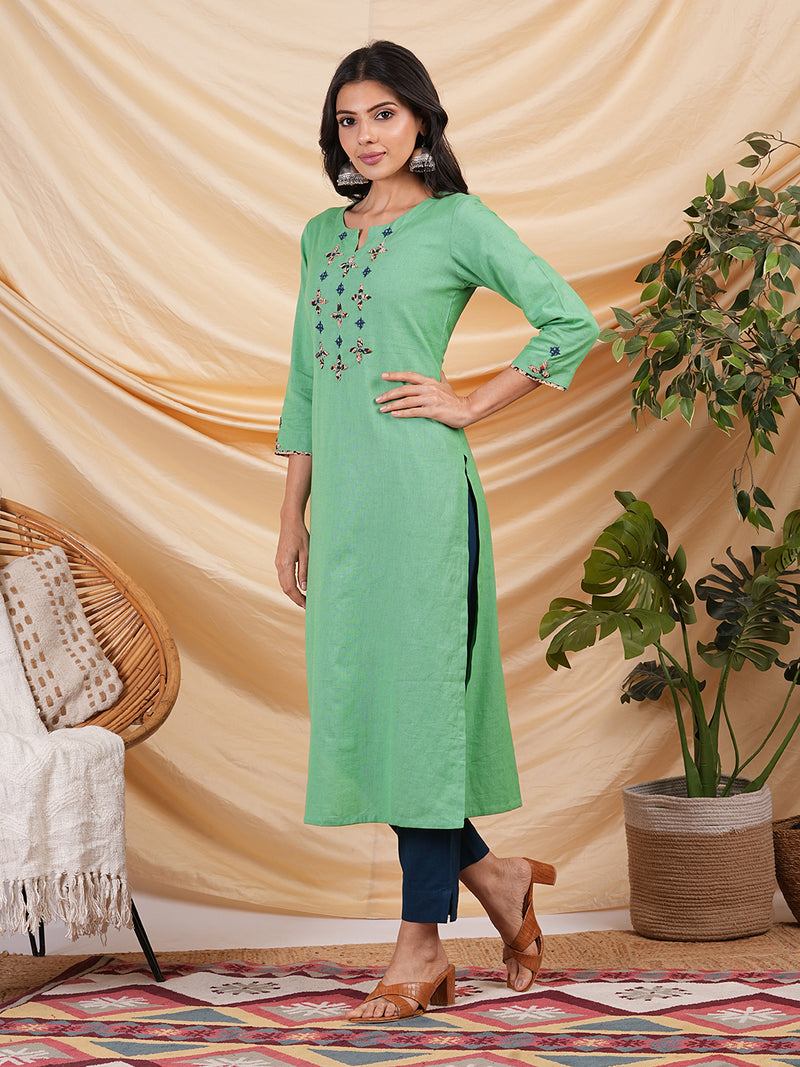 Straight Cotton flax kurta with hand embroidery and hand applique detailing.