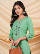 Straight Cotton flax kurta with hand embroidery and hand applique detailing.