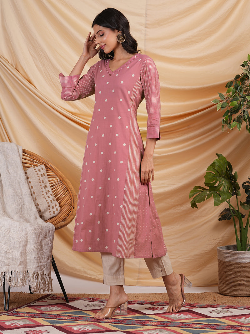 A line kurta with blend of different cotton prints & pocket.