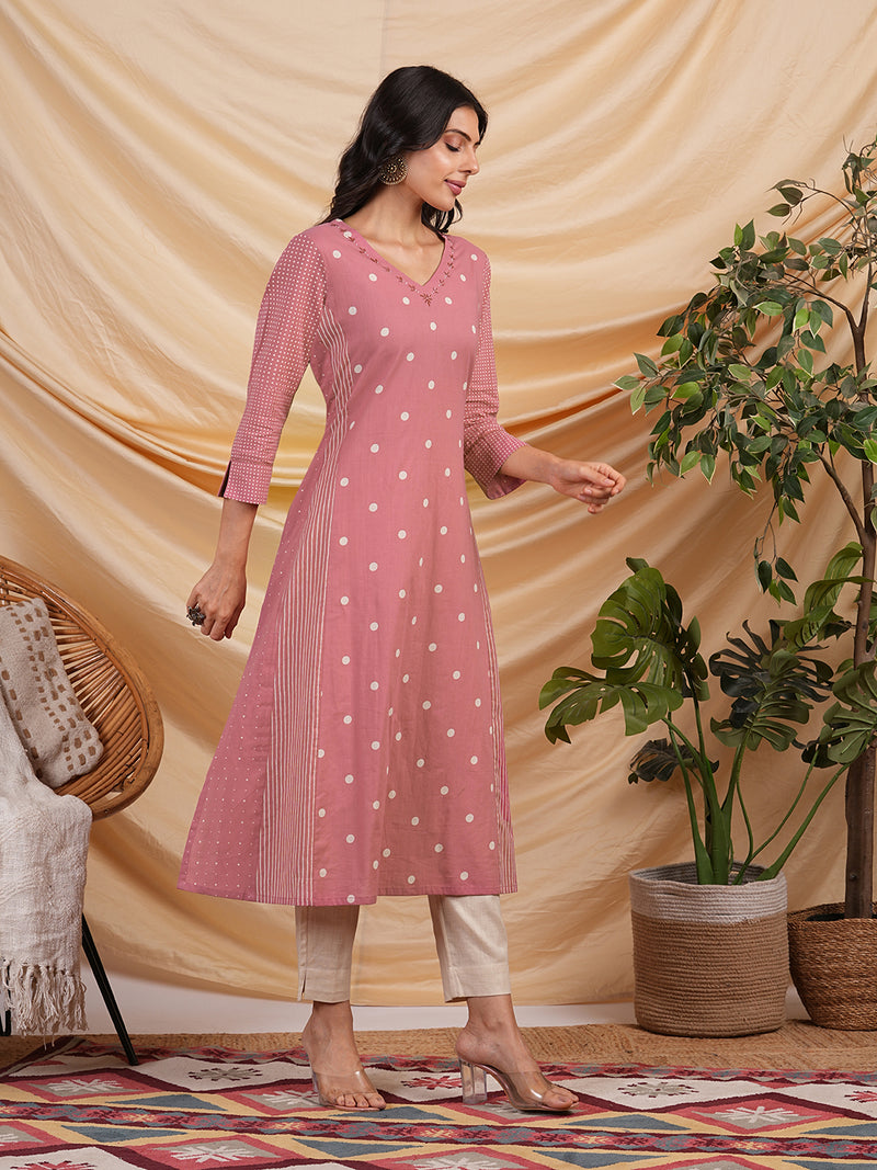 A line kurta with blend of different cotton prints & pocket.