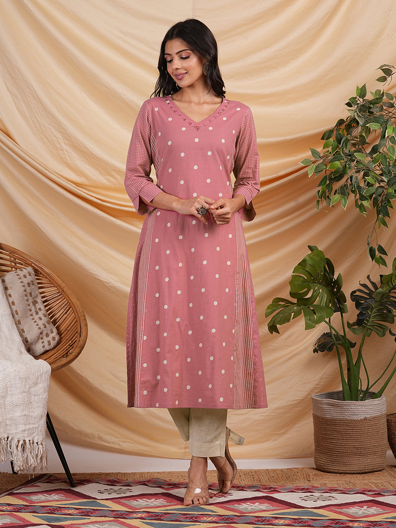 A line kurta with blend of different cotton prints & pocket.