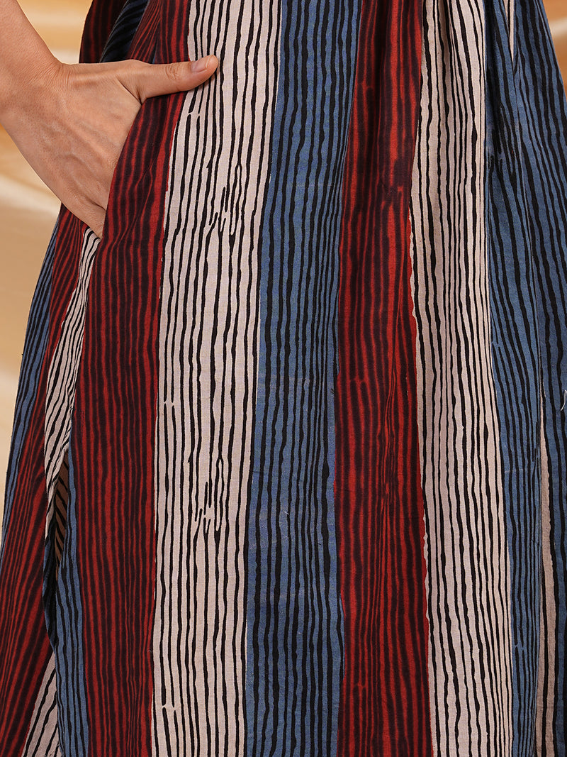 A-Line Hand block printed sleeveless kurta with pleat and handwork detailing.