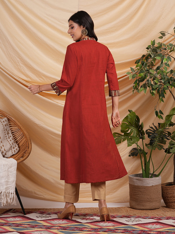 A line cotton kurta with hand applique and embroidery detailing.