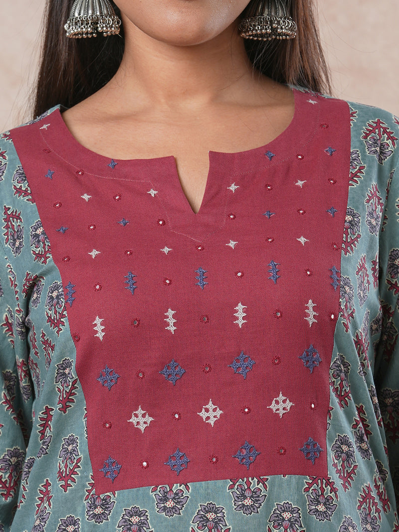 Straight cut printed kurta with a hand embroidered yoke and sleeve details.