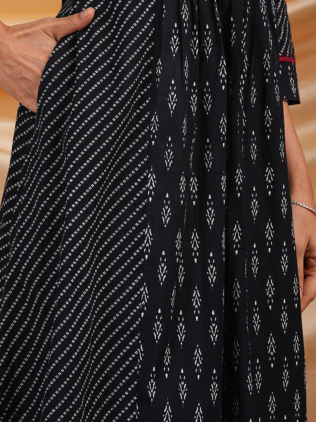 Flared Printed cotton kurta with a blend of two different prints with pleat & hand embroidery