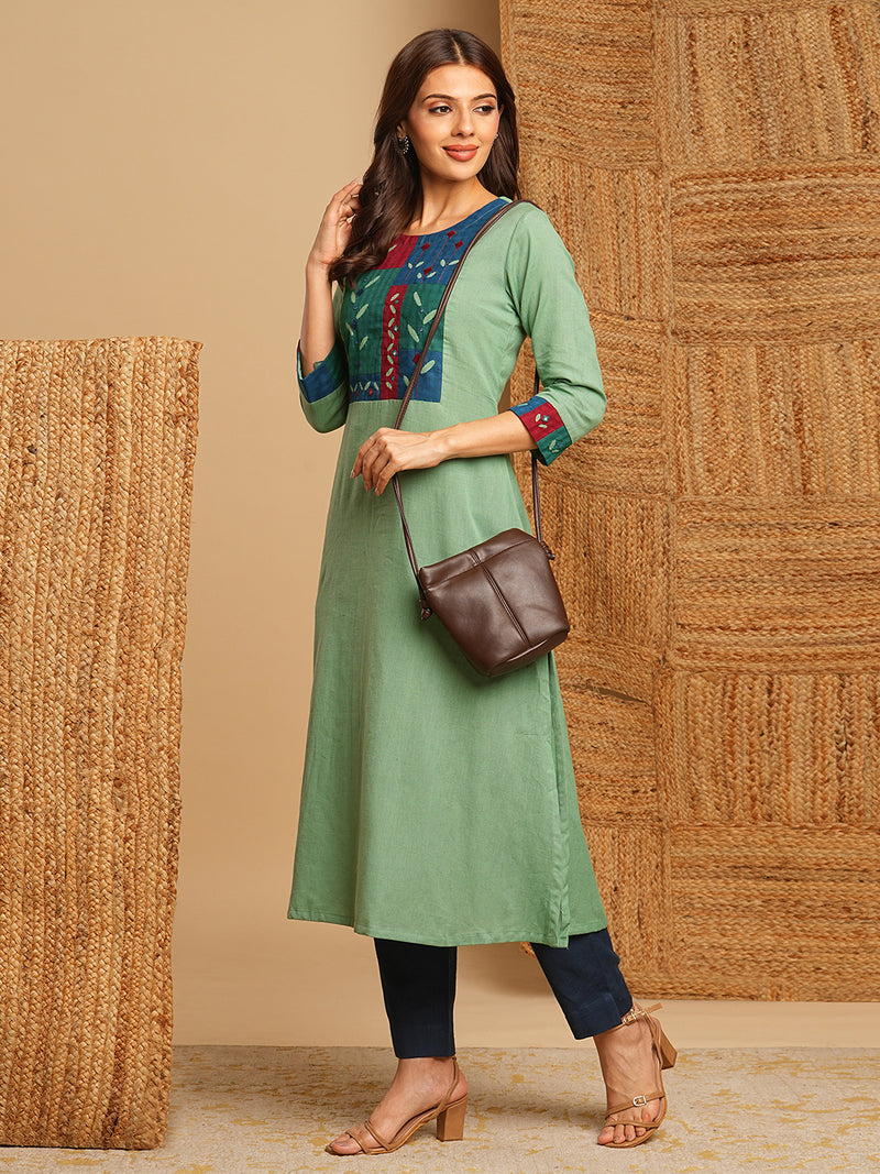 A-line kurta in cotton blend fabric with hand embroidery and applique detailing.