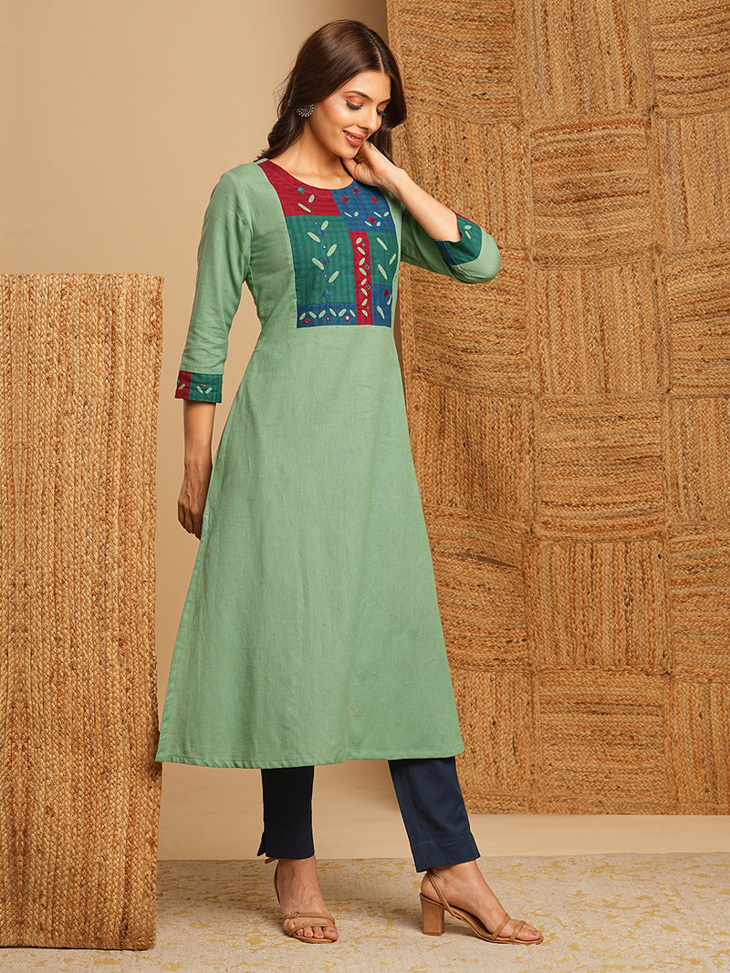 A-line kurta in cotton blend fabric with hand embroidery and applique detailing.